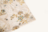A sequin floral embroidery fabric on a cream velvet base, with blue and gold motifs.