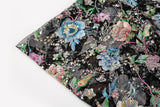 A multi-color floral sequin embroidery fabric on a black mesh base.