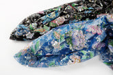 A multi-color floral sequin embroidery fabric on a black mesh base.
  A multi-color floral sequin embroidery fabric on a sapphire blue mesh base.