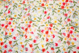 A 3D embroidery fabric with a multi-color wildflower pattern, embellished with sequins and beads.