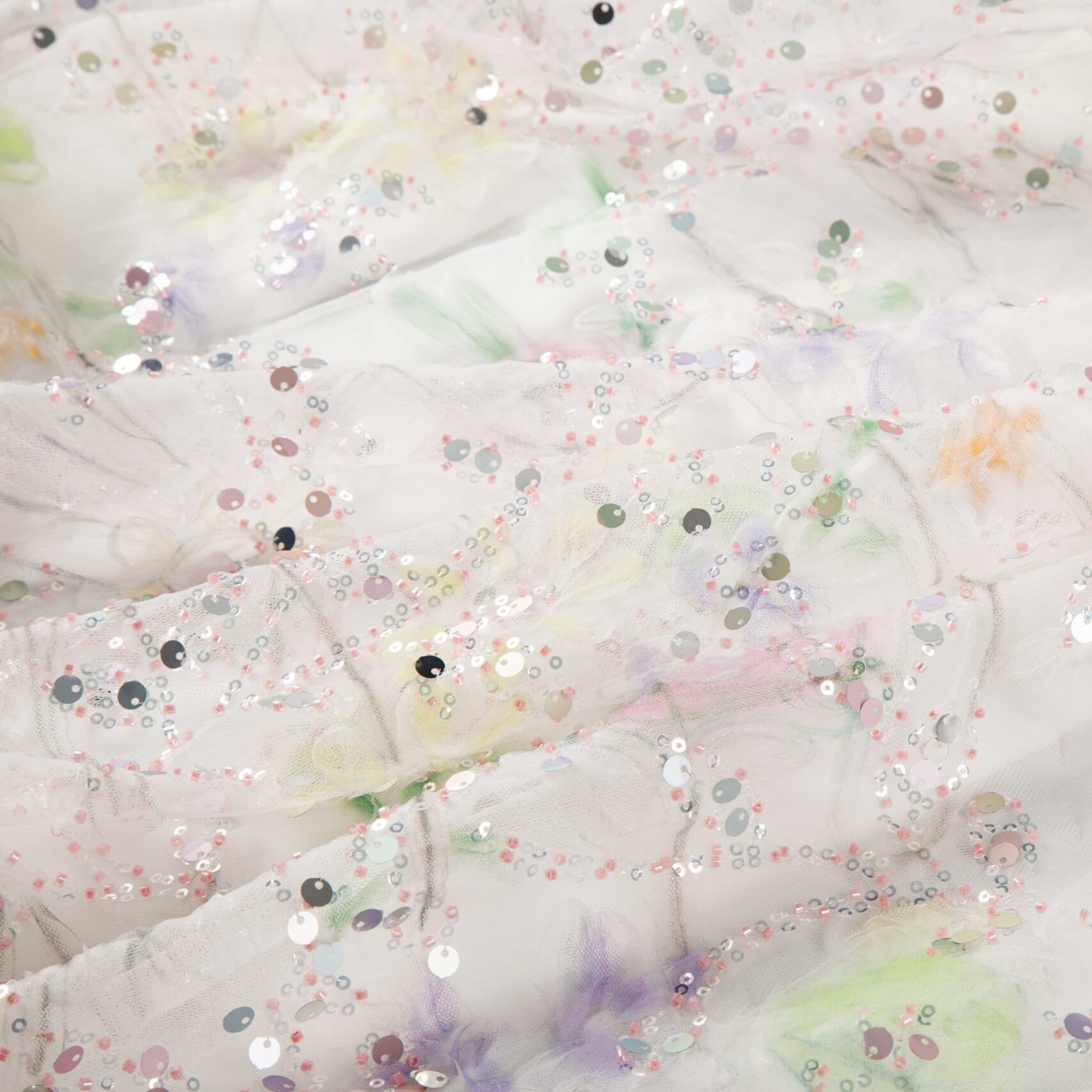 Mixed sequin and ribbon embroidery – sequin accents with ribbon tape work on fabric for dimensional effects
