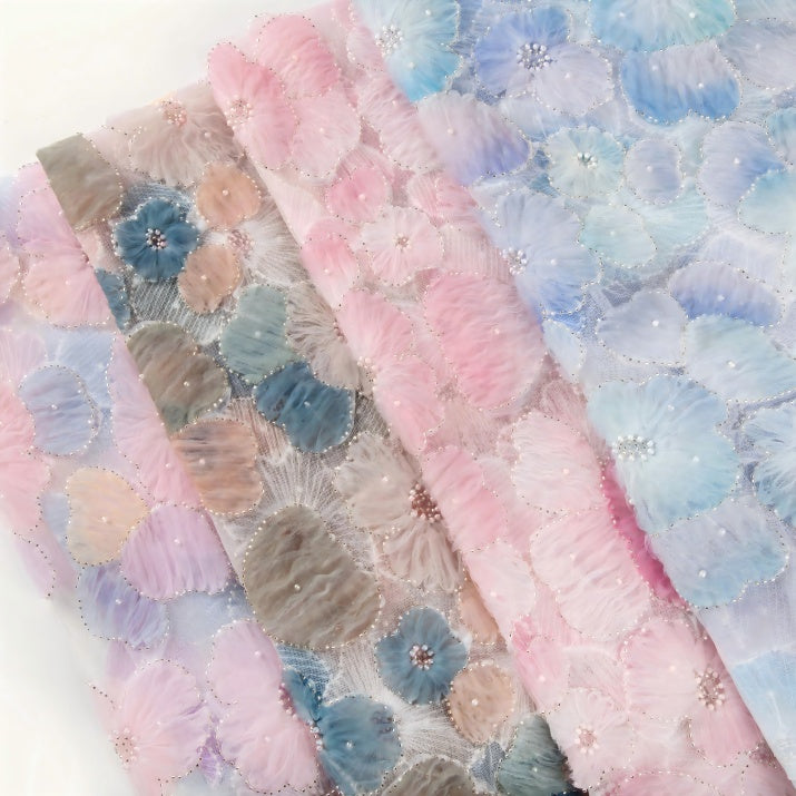 Embroidered fabrics in various colors and patterns