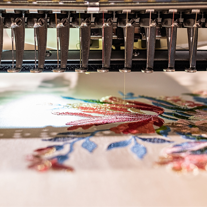 Embroidery machine embroidering on fabric