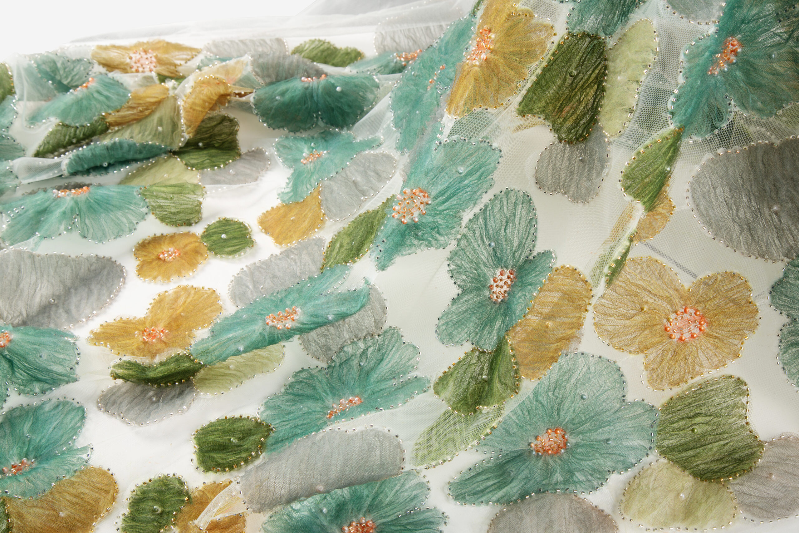 Three-dimensional cording embroidery finish on apparel base fabric