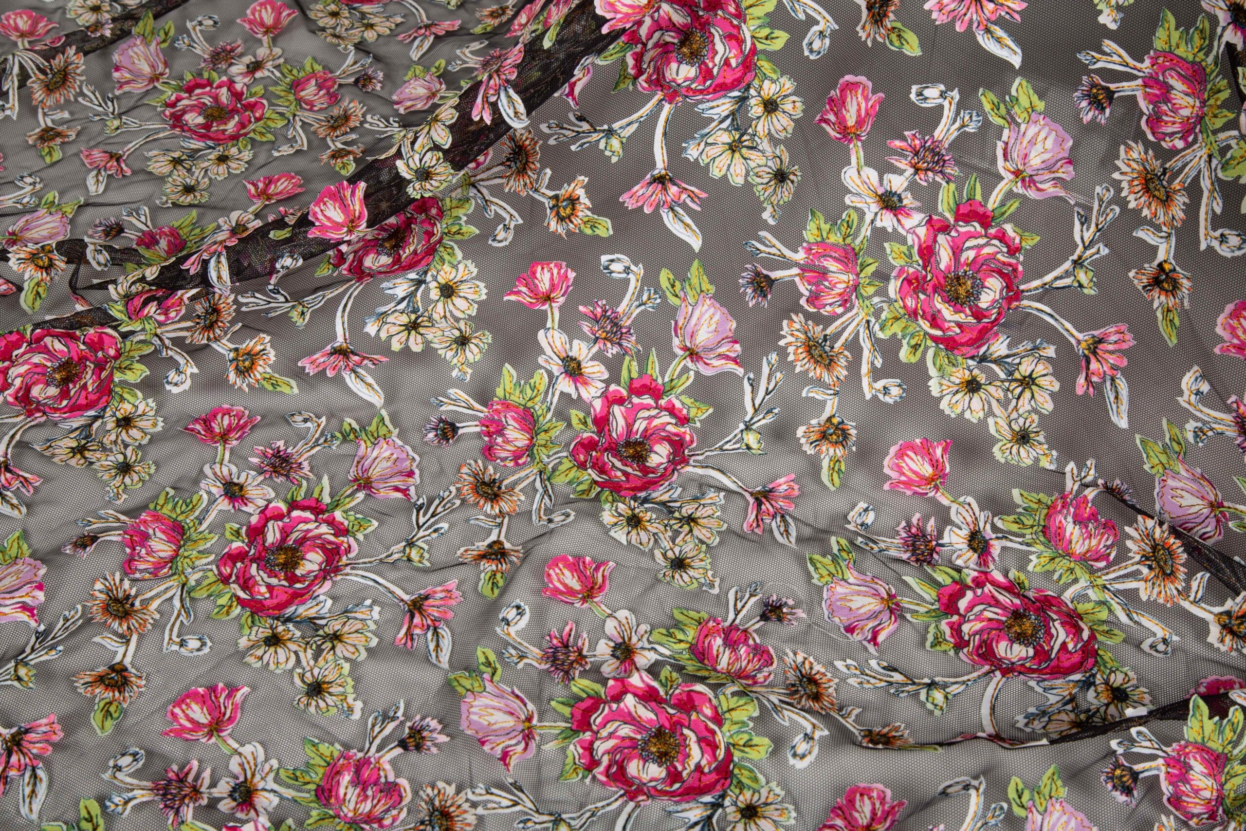 Layered Floral Applique Embroidery Fabric Layered floral applique embroidery fabric with textured stitching and dimensional fabric details for fashion garments